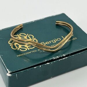 ...Sergio Lub...Gold Tone Wave Design Cuff‎ Bracelet...